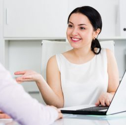 Young female manager meeting woman client in office
